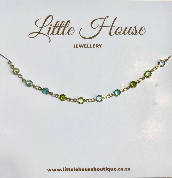 Gold links with round mixed stones (blues)