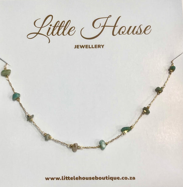 Gold chain with round dark green stones -long